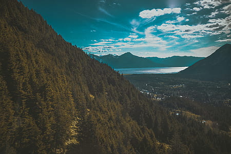 mountain range under blue sky thumbnail