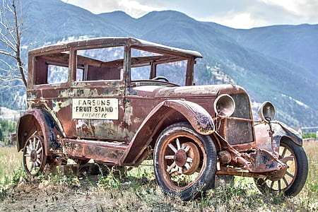 classic brown vehicle on grass field during daytime thumbnail