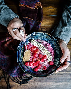 person holding black bowl filled thumbnail