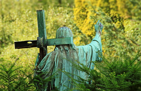 Christ carrying cross surrounded with grass statuette thumbnail