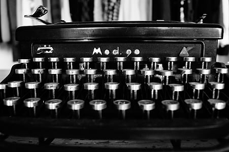 grayscale photography of typewriter thumbnail