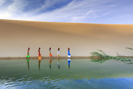 woman walking in body of water thumbnail