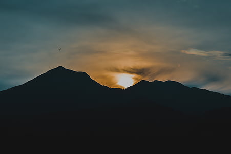 silhouette of mountains during golden hour thumbnail