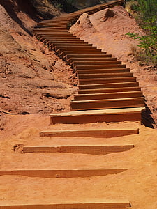 grey concrete staircase between mountain during daytime thumbnail