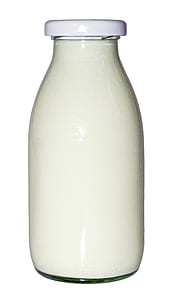 clear glass bottle with white liquid thumbnail