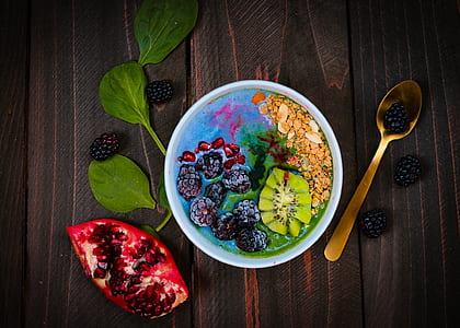 flatlay photography of blueberry, pomegrenate and cereals thumbnail