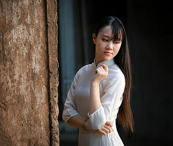 Women in White Long-sleeved Dress thumbnail