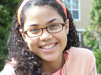 close-up photography of smiling girl during daytime thumbnail