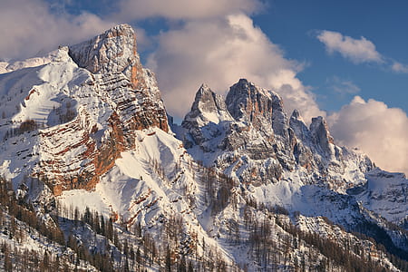 white and brown mountain under clouds at daytime thumbnail