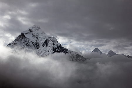 mountain covered by snow surrounded by stratus clouds thumbnail