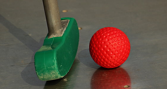 green golf putter and red ball thumbnail