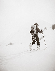 grayscale photo of a person skiing on snow thumbnail