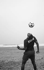 Man on Shore Doing Soccer Trick thumbnail