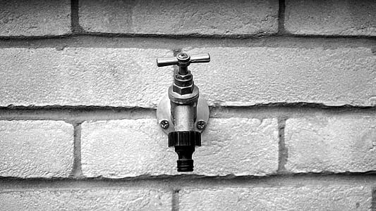 gray wall with stainless steel faucet thumbnail