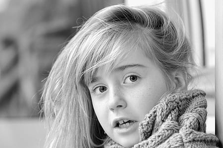 grayscale photo of girl wearing knitted apparel thumbnail