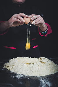 person putting egg on flour thumbnail