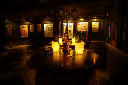 round black wooden table with light fixtures thumbnail