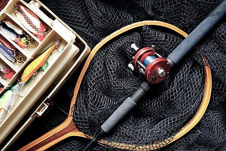 brown fishing net and black fishing rod thumbnail