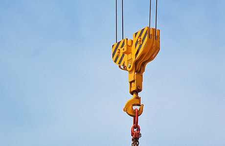 yellow industrial hook at daytime thumbnail