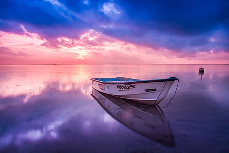 White Boat in Body of Water thumbnail