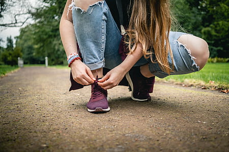 Woman Tying Her Shoes thumbnail