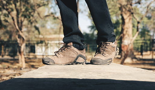 Selective Focus Photography of Person Wearing Brown Hiking Shoes thumbnail
