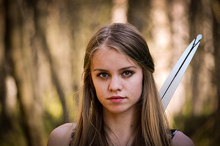 selective photo of brown and blonde haired woman looking straight to the camera thumbnail