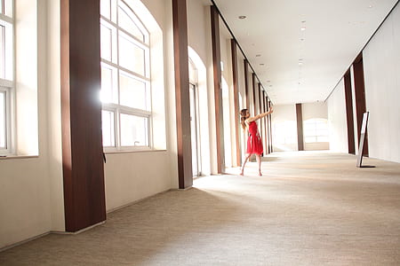 woman standing near window thumbnail
