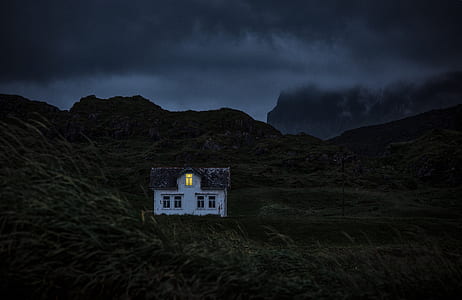 lighted house on mountain during nighttime thumbnail