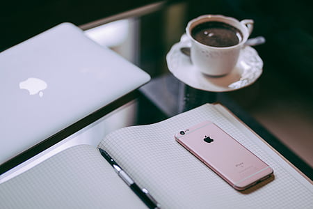 rose gold iPhone 6s on top of graphing book thumbnail