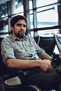 sitting man wearing gray chambray long-sleeved shirt thumbnail