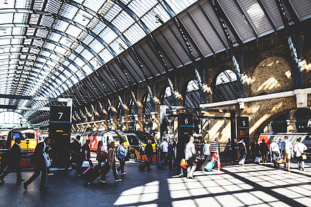Train passengers at a busy railway station at Kings Cross in Central London. Image captured with a Canon 6D DSLR thumbnail