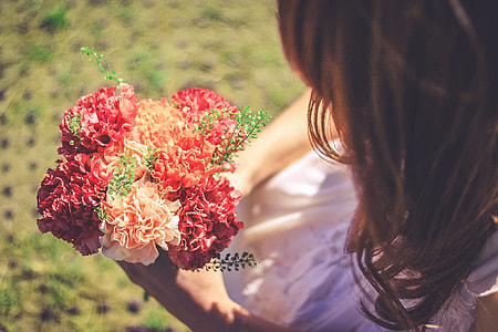 woman holding flower bouquet thumbnail