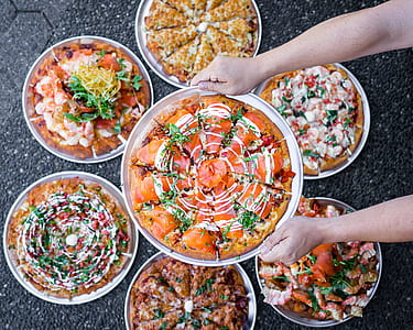 person showing different kinds of dish during daytime thumbnail