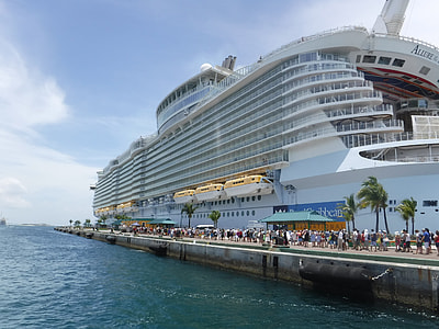 people standing near cruise ship at daytime thumbnail
