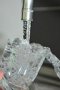 clear drinking glass filling up with water thumbnail
