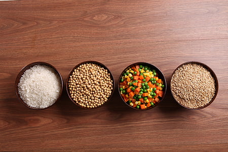 four brown ceramic bowls filled with grains and beans thumbnail