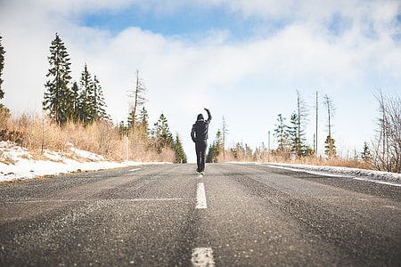 Man in a Winner Pose Walking on the Road thumbnail