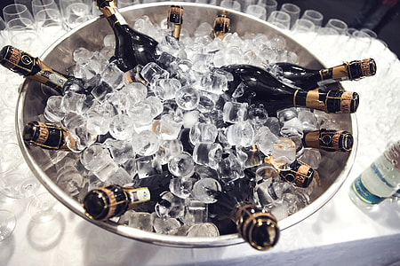 wine bottles on bucket with ice thumbnail