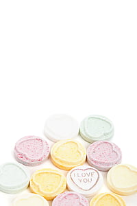 heart-shaped assorted-color candies on white pad thumbnail