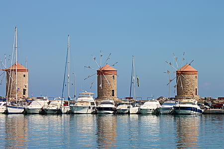white boats on marina under clear blue sky thumbnail