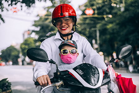 woman with baby riding motorcycle thumbnail