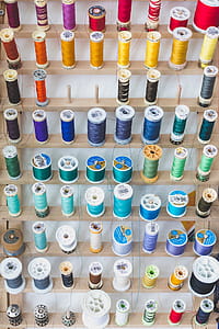 Colorful Sewing Threads On Wall Photo thumbnail