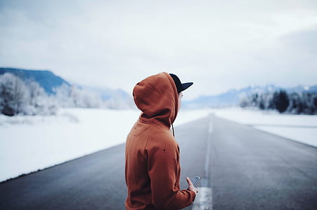 Man Wearing Brown Hoodie in Road thumbnail