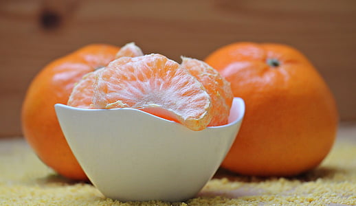 orange fruit on ceramic bowl thumbnail