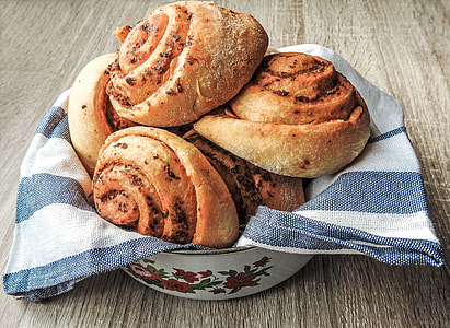 baked breads on white and black textile thumbnail
