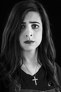 Monochrome Photography of Woman Wearing Cross Necklace thumbnail