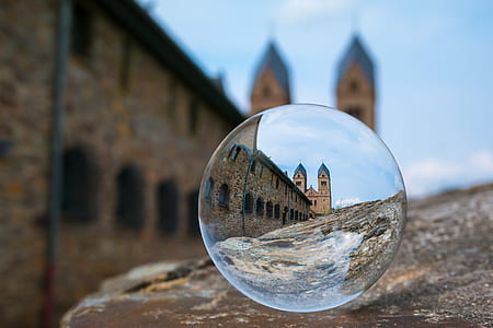 crystal ball photography of brown building thumbnail