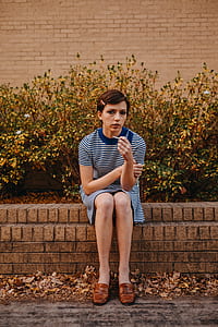 woman sitting at concrete bench thumbnail
