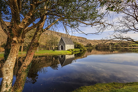 gray house and river thumbnail